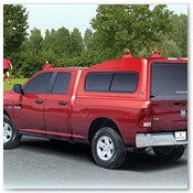 Red Truck Parked in Front of Soccer Game