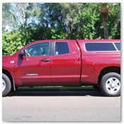 Red Tundra Equipped with Century Truck Cap
